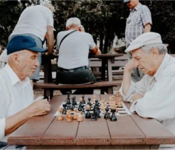 Two Men Enjoying A Game Of Chess